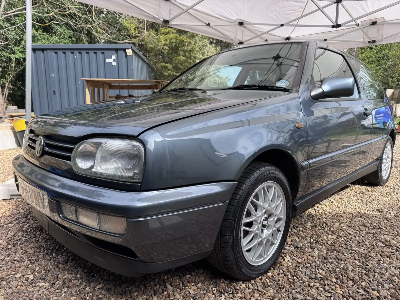 The same VW Golf after a full valet, restored to a deep showroom gloss