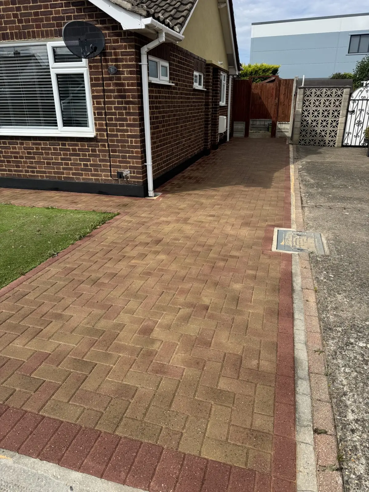 The same block paving driveway after cleaning, bright and even