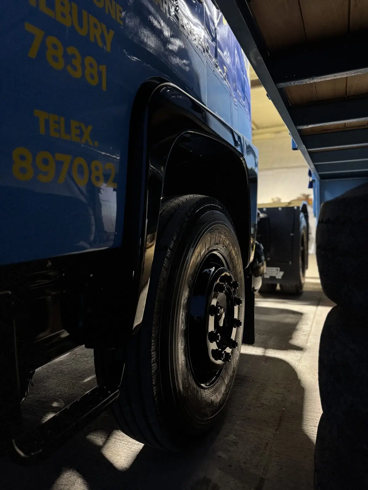 Blue Scania lorry gleaming after a full exterior valet, Essex