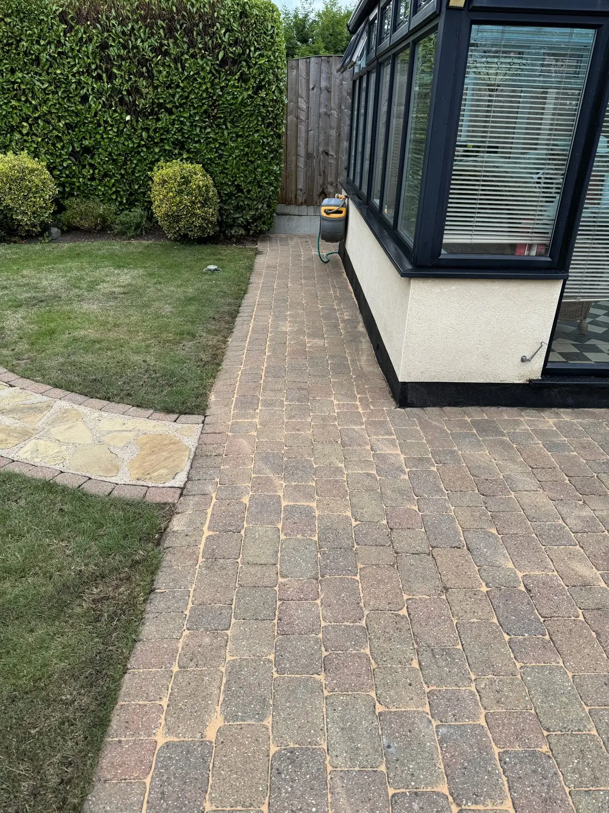 The same conservatory path after cleaning, algae removed