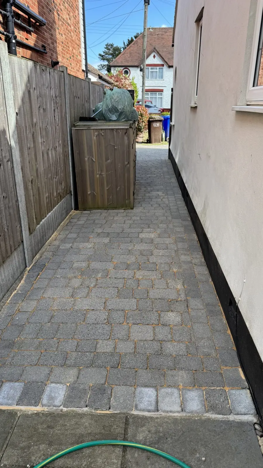 The same side path after cleaning, moss cleared and colour restored