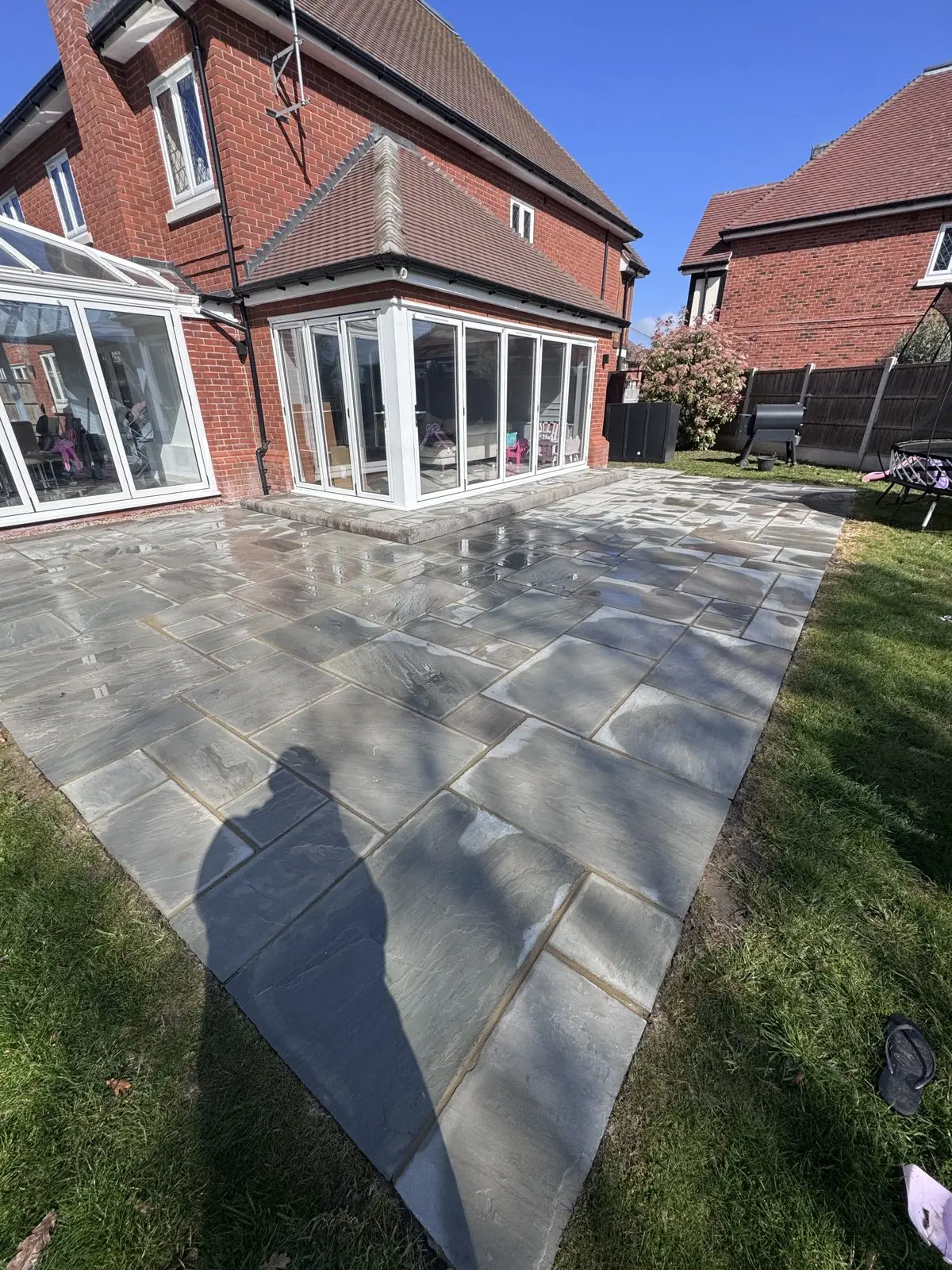 The same sandstone patio after cleaning, clean and evenly toned