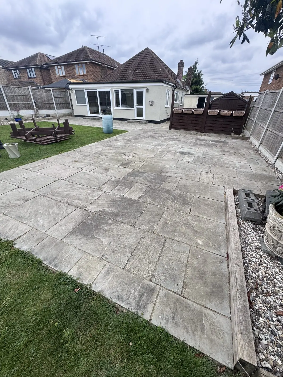 Indian sandstone patio before cleaning, covered in ingrained dirt