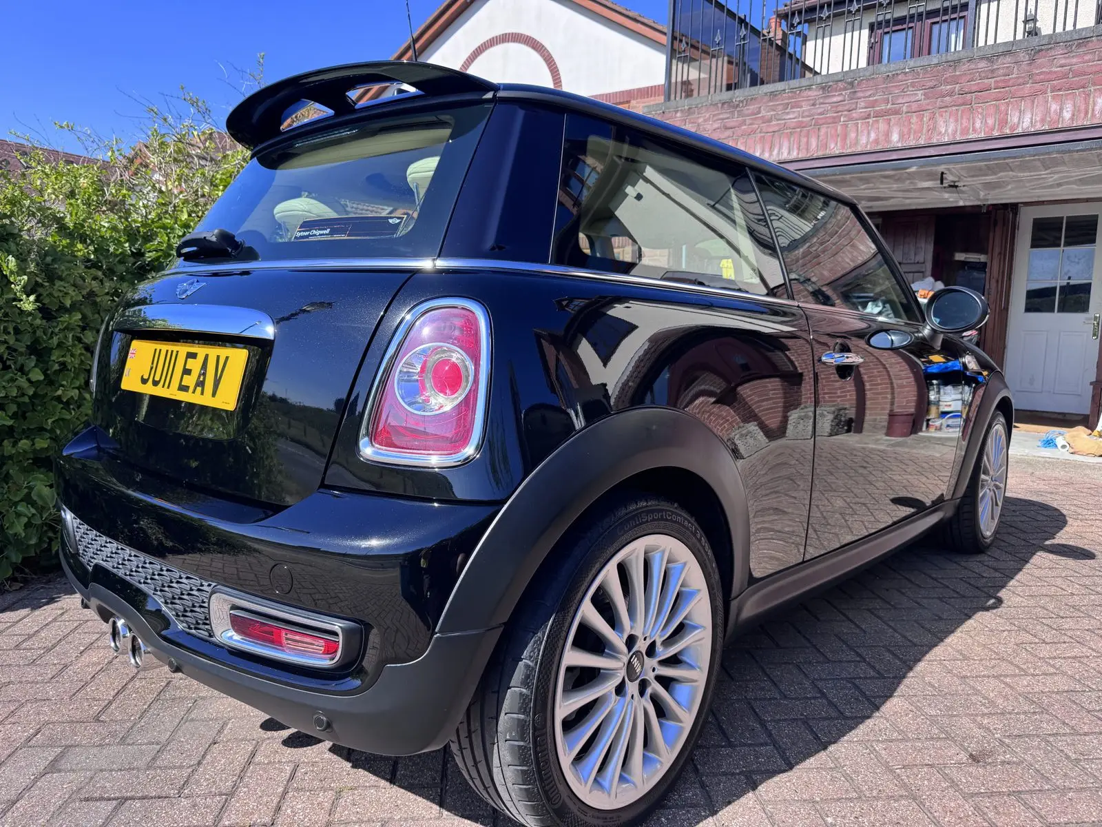 Ceramic-coated black Mini Cooper with a protected, glossy finish, Essex