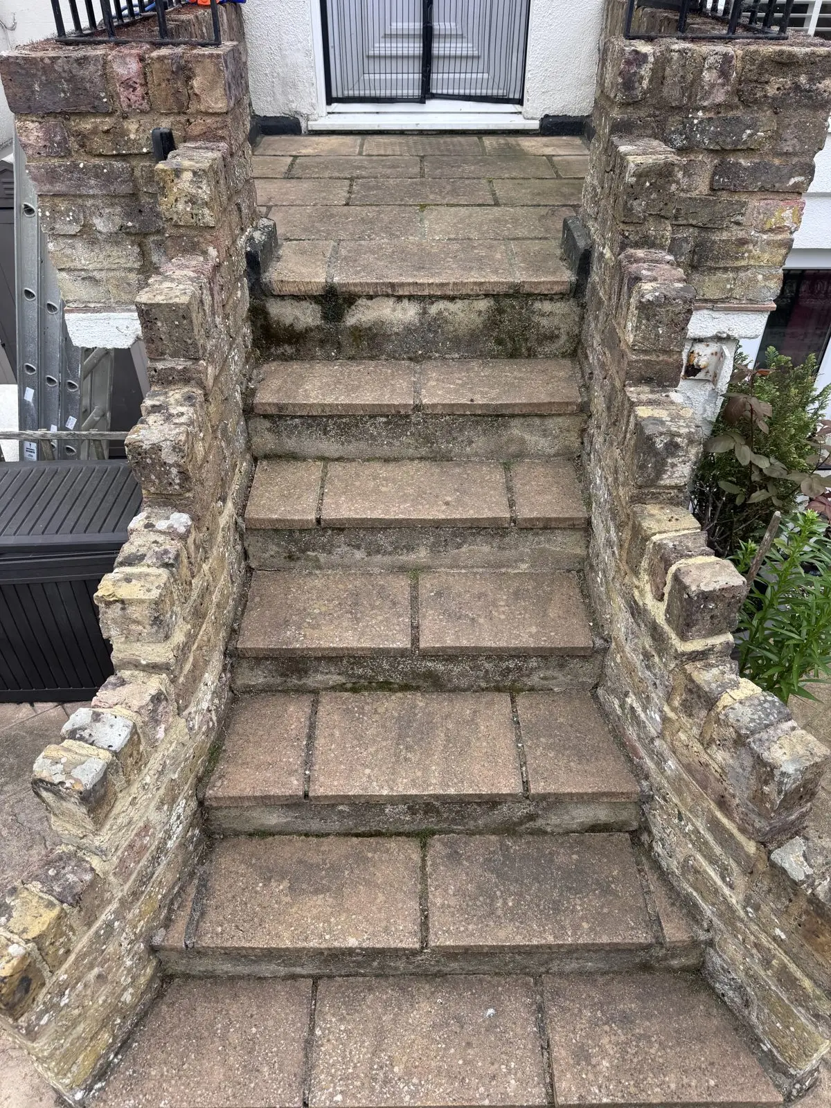 Stone garden steps before cleaning, slippery with algae and grime